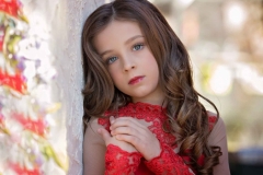 child-close-up-photography-styled-red-dress