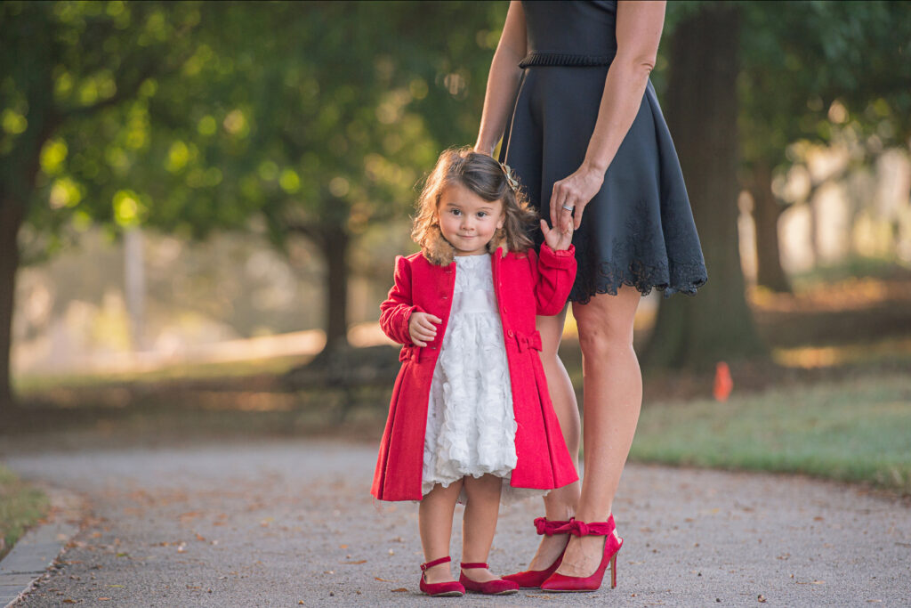 Girl in Red jacket, mom with red shoes